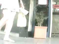 Long legged brunette upskirt voyeur video