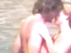 Naked couple at beach - voyeur video