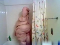 Superfat redhead chick takes a shower