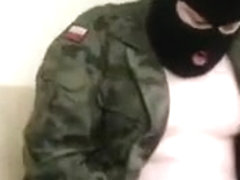 Masked dude in a uniform jerks off