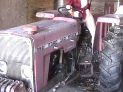 Sexy girl masturbating on a tractor