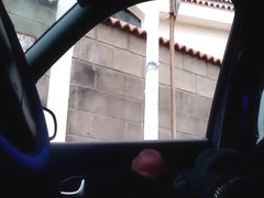 Jerking cock in the car while women walking around
