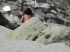 Spied on and filmed a concupiscent random couple fucking on the beach