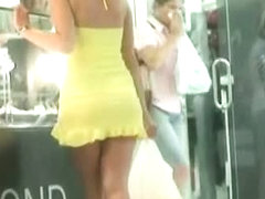 Upskirt clip with babe in sexy high heels and short yellow dress