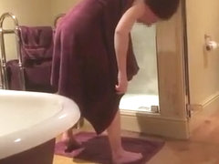 Husband films his wife drying her body