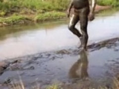 Wetsuit and mud
