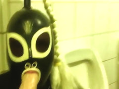 Rubberdoll Monique - Blowjob training in a public toilet