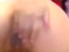 Brunette masturbates with dildo