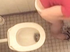 Naked girl is pissing on the hidden cam in the toilet