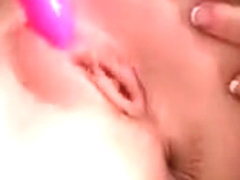 Blonde nymph vibing her clit and her slick pussy hole