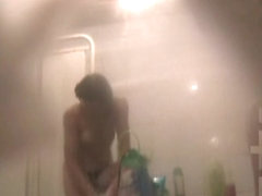 Fem flashes bushy nub and tits on hidden shower cam
