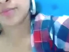 A hot girl showing her milk on webcam.