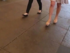 Sexy white girl walking with decent short one.
