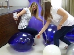 Two amateur girls Pop balloons