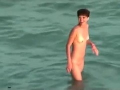 Voyeur tapes a couple having sex in the sea and on the beach