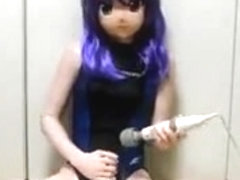 Kigurumi has a Japanese doll mask, while using vibrator