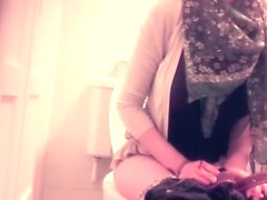 Modern looking woman on the toilet