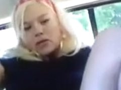 Blue-eyed blonde fingering her butthole in the backseat