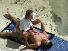 Voyeur tapes a couple having missionary and cowgirl sex on a nude beach