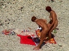 Two mature sluts naked on a beach