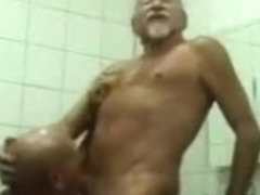 Mature gay men fuck in a public toilet