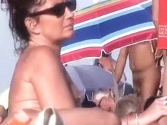 Horny mature nudists at a beach