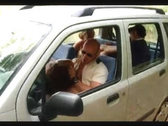 2 couples in car on the road