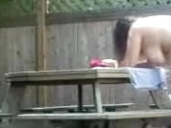 Fucking in the back yard, on picnic table.  Nice facial finish.