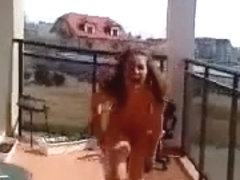 Polish girl strips on the balcony