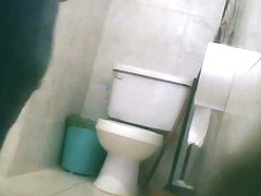 Hidden toilet cam catches chubby Latina chick pissing
